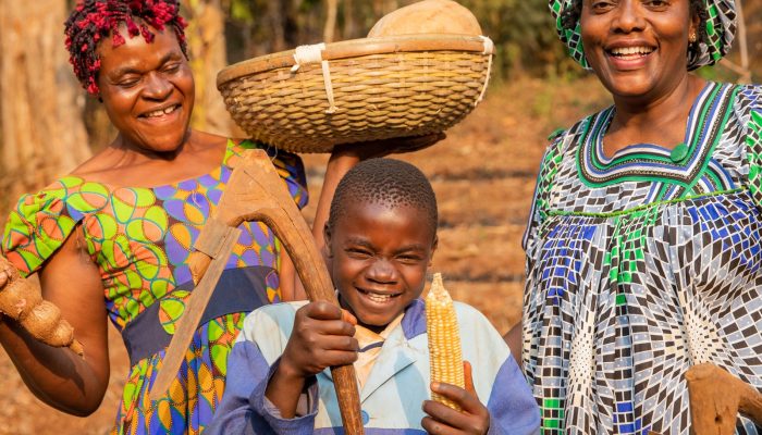 celebrating-a-harvest-with-two-women-and-a-child-1600x1600