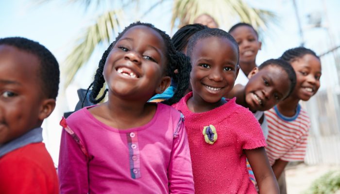 children-happy-and-line-in-portrait-at-community