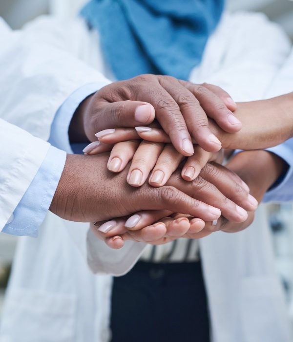 medical-teamwork-hands-together-for-success-1200x1600